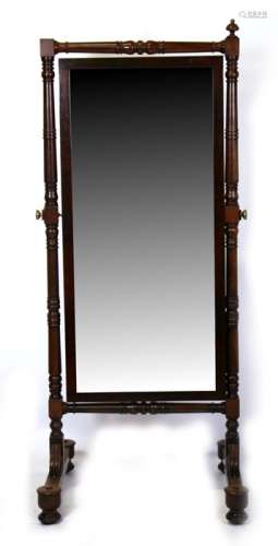 A 19th century mahogany cheval mirror on turned supports, 74cms (29ins) wide.