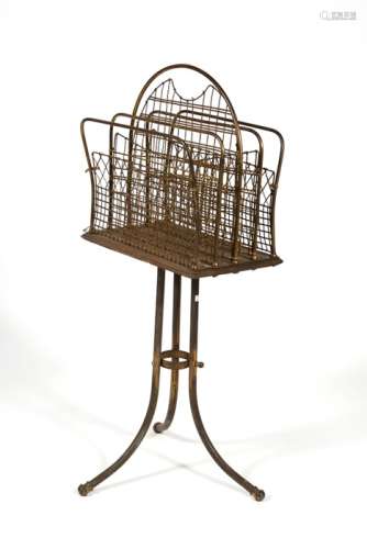 A Victorian oak and brass four-division magazine rack, 38cms (15ins) wide.