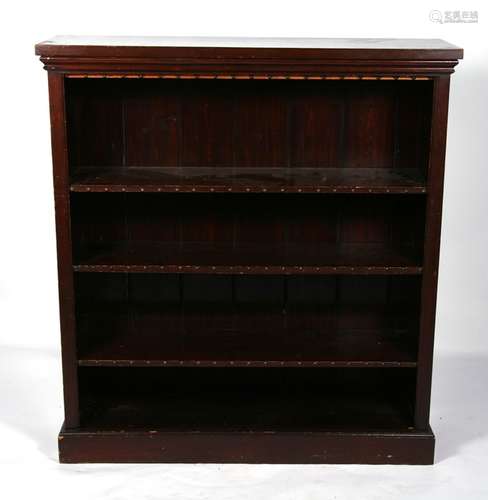 A late 19th century walnut open bookcase with three adjustable shelves, on a plinth base, 106cms (