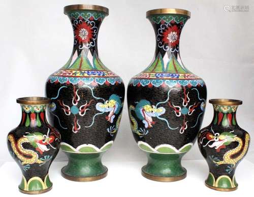 A pair of Chinese cloisonne vases decorated with dragons chasing a flaming pearl, on a black ground,