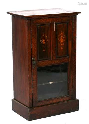 An Edwardian figured walnut music cabinet, 54cms (21.25ins) wide.