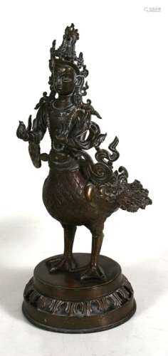 A South East Asia bronze figure of Kinnaris, 36cms (14ins) high.