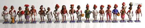 A group of nineteen carved and painted wooden figures depicting people of the Punjab, 10cms (4ins)