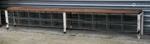 A wirework locker room or hall bench, the pine seat above 18 wirework pigeon holes, 230cms (90.5ins)