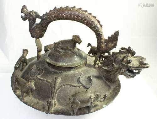 A 19th century China Straights bronze teapot with dragon handle and applied animals, 23cms (9ins)