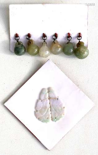 A pair of Chinese carved jade earring drops, 4cms (1.5ins) high; together with a set of six jade and