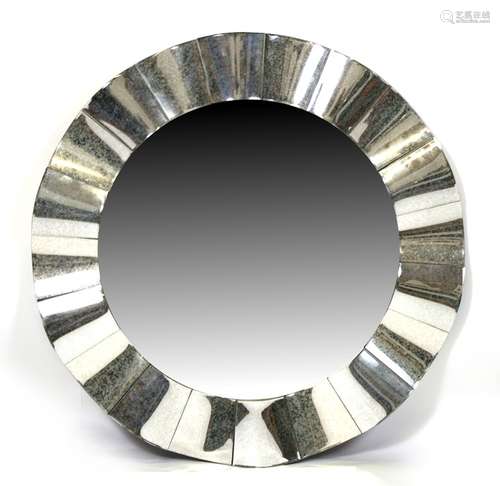 A modern design circular wall mirror, 99cms (39ins) diameter.