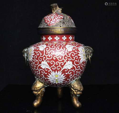 A cloisonne tripod censer with lion mask handles and fo dog finial, decorated with flowers on a