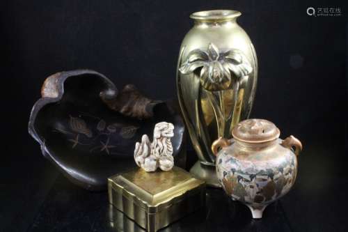 A Japanese bronze vase decorated in relief with a cast iris, impressed makers mark to underside,