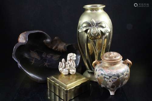 A Japanese bronze vase decorated in relief with a cast iris, impressed makers mark to underside,