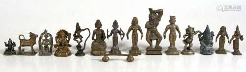A group of fourteen Indian bronze deity figures, the largest 14cms (5.5ins) high.