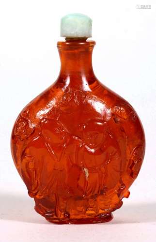 A Chinese amber snuff bottle decorated in relief with figures and bats. 7cm (2.75 ins) high
