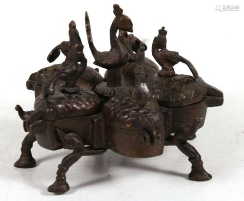 An Indian bronze spice box (Kumkum) with five leaf form compartments, each surmount with a bird with