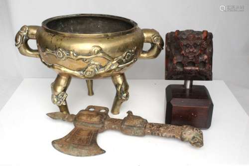 A Chinese two-handled bronze censer decorated with prunus, four- character mark to underside,
