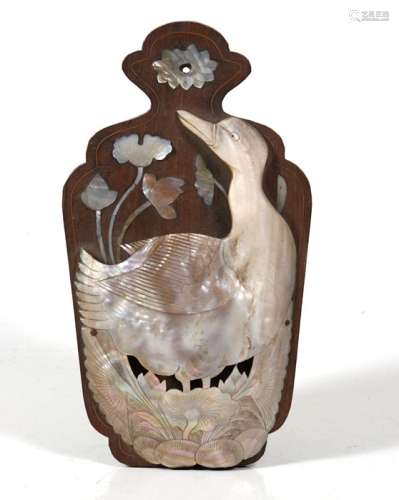 An Asian carved mother of pearl wall pocket in the form of a bird in foliage, 24cms (9.5ins) high.