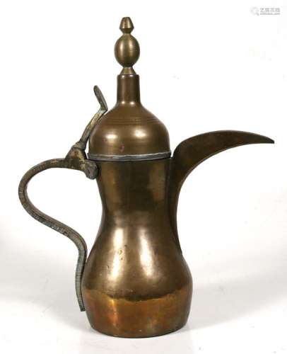 A large Turkish / Islamic brass dallah coffee pot with impressed mark to the side, 39cms (15.