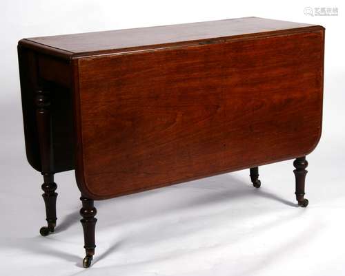 A Victorian mahogany drop-flap table on turned legs, 107cms (42ins) wide.