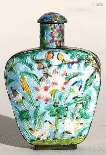 A Chinese enamel snuff bottle decorated with flowers and birds, 8cms (3.1ins) high.