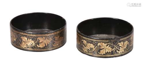 A pair of George IV painted and lacquered papier mâché wine coasters, circa 1825