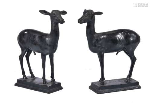 A pair of patinated bronze models of deer after the Antique