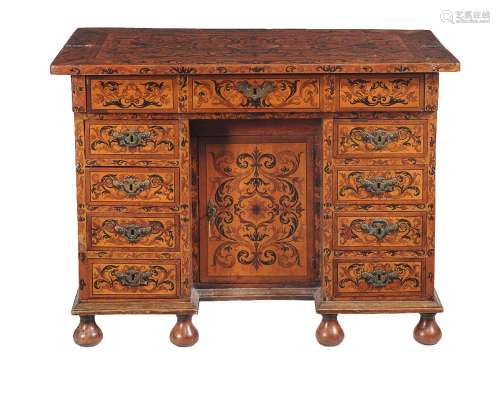 A Continental sycamore marquetry inlaid knee hole desk, circa 1700