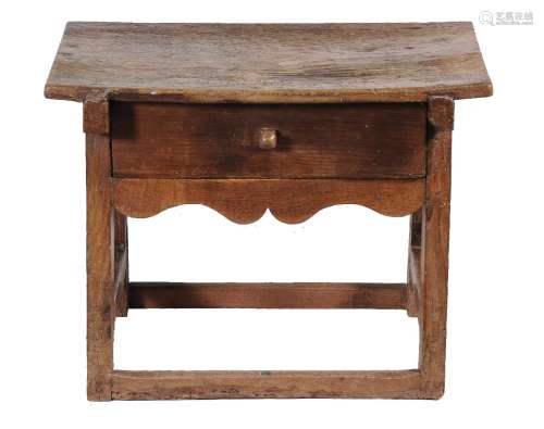 A Continental, possibly Tyrolean oak and hardwood table stool, late 17th/early 18th century