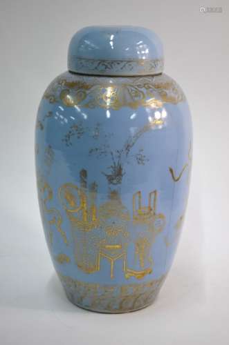 An unusual Chinese claire-de-lune slender oviform vase with domed cover; highlighted in gilt with
