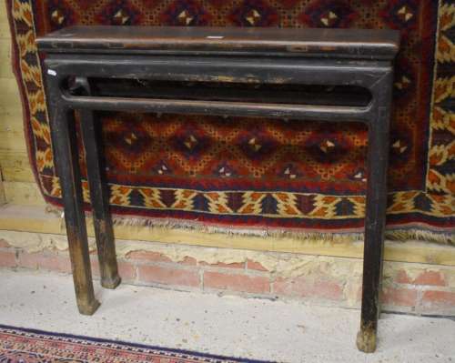 An antique Chinese elm scribes table, the rectangular cleated top raised on four square legs, 91