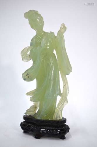A bowenite, or other mottled green, figure of a standing Chinese Handmaiden, 19.5 cm highSome