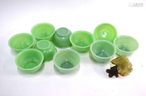 A set of ten Beijing, green glass bowls, each one 11 cm diameter; together with a Chinese bowenite