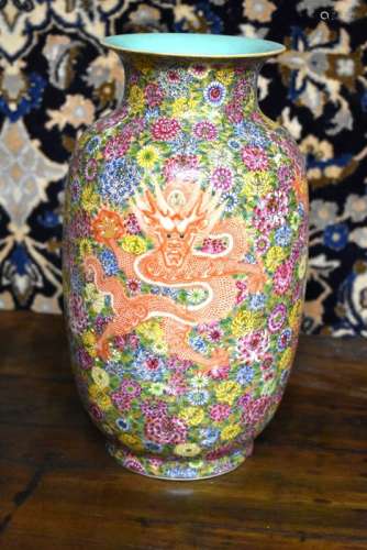 A Chinese famille rose vase, decorated with coiled dragons on a millefleurs ground; 33 cm high, blue