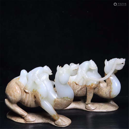 A PAIR OF CARVED HETIAN JADE CAMEL ORNAMENTS