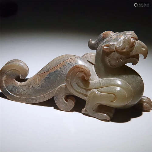 A CARVED HETIAN JADE PHOENIX ORNAMENT