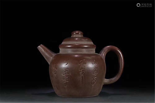 AN OLD MASS VOLUME PURPLE CLAY TEAPOT