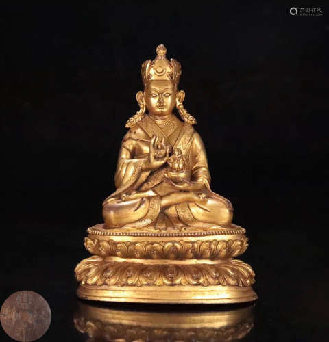 A GILT BRONZE MOLDED BUDDHA SITTING STATUE