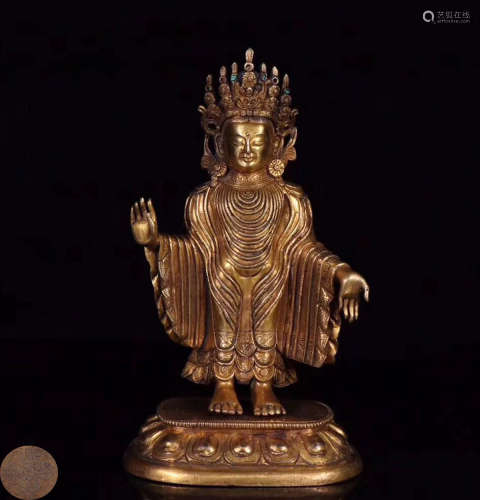 A GILT BRONZE MOLDED BUDDHA STANDING STATUE