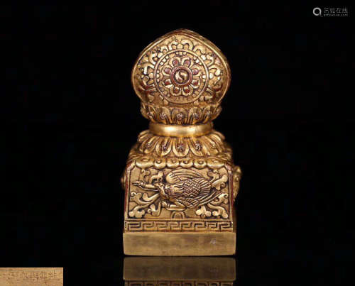 A GILT BRONZE MOLDED TIBETAN BUDDHIST SEAL