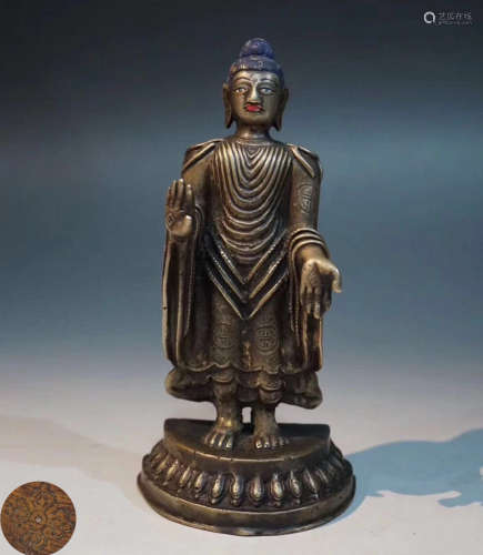 A TIBETAN BUDDHA STANDING STATUE