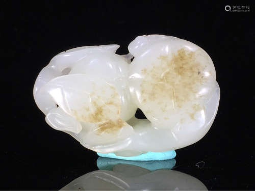 A HETIAN JADE MONKEY SHAPED PENDANT