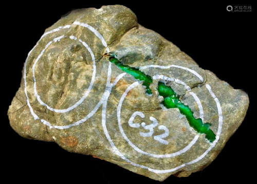 A BURMESE GREEN JADEITE STONE, A CLASS