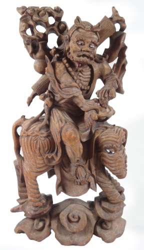 A 19thC root carving, formed as a Chinese gentleman riding on an elephant, on a naturalistic