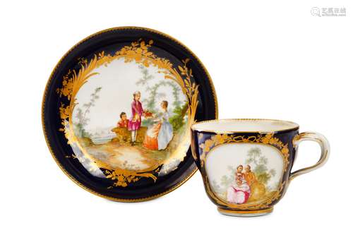 A MEISSEN BLUE-GROUND TEACUP AND SAUCER