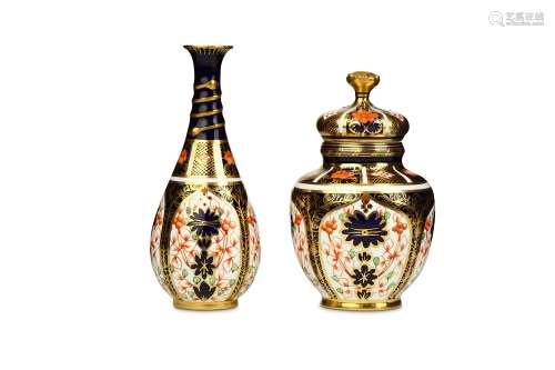 A ROYAL CROWN DERBY JAR AND COVER AND A VASE