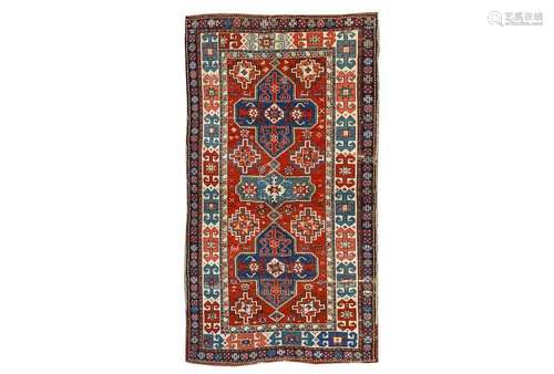 AN ANTIQUE AKSTAFA RUG, SOUTH-EAST CAUCASUS approx: 7ft.7in. x 4ft.(231cm. x 122cm.) The rust