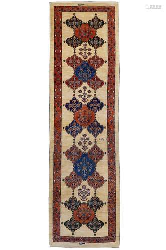 A FINE SIGNED KASHKULI RUNNER, SOUTH-WEST PERSIA approx: 9ft.6in. x 2ft.9in.(289cm. x 84cm.) Very