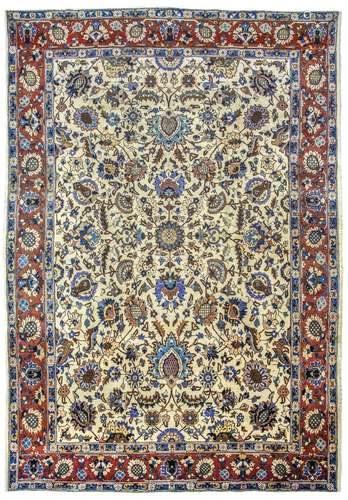 A TABRIZ CARPET, NORTH-WEST PERSIA approx: 12ft.11in. x 9ft.5in.(394cm. x 286cm.) The ivory field