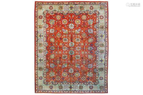 A FINE TABRIZ CARPET, NORTH-WEST PERSIA approx: 10ft.1in. x 7ft.9in.(307cm. x 236cm.) The rust field