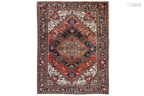 A HERIZ CARPET, NORTH-WEST PERSIA approx: 9ft.1in. x 6ft.9in.(276cm. x 206cm.) Classic for this type