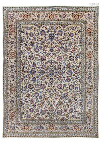 A KASHAN CARPET, CERNTRAL PERSIA approx: 13ft.10in. x 9ft.10in.(422cm. x 299cm.) The ivory field