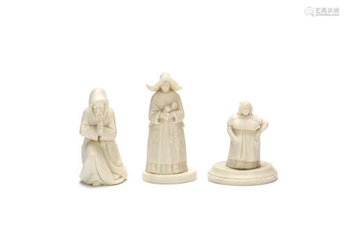 Circa 1860 The kneeling monk, Sister of Charity and The French Cook: three early Kerr and Binns parian extinguishers and two stands